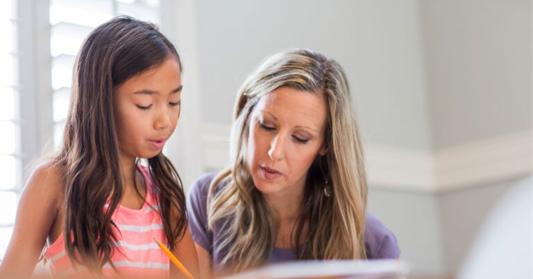 Family Assistant working with nanny kid to help with homework afterschool