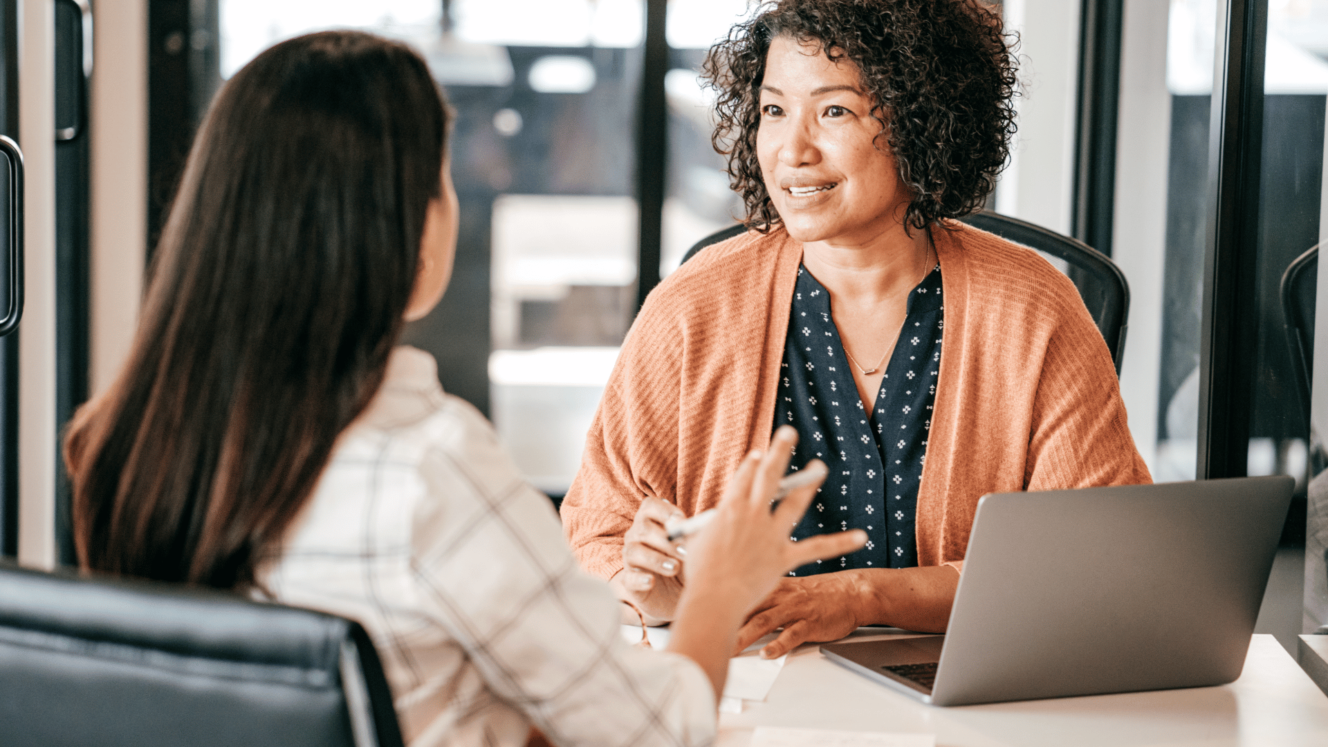 A parent discussing nanny placement options with a nanny agency